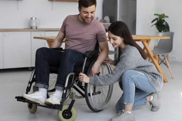 young-adult-helping-disabled-fri-1024x732